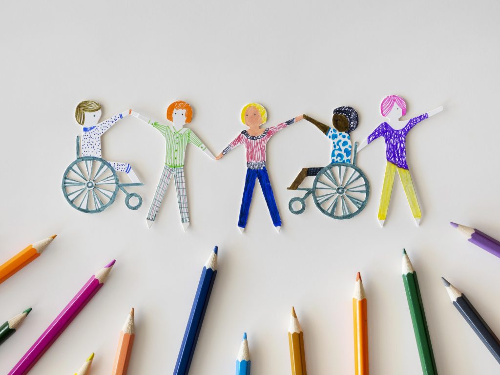 QUIENES SOMOS... Multi Ethnic Disabled People Community With Pencils 1024x768